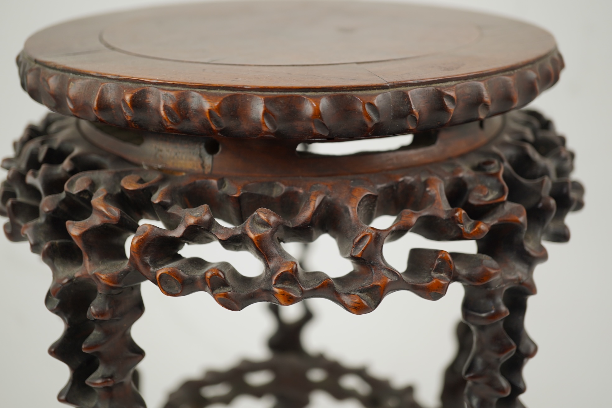 A Chinese hardwood scholar’s stand, carved in imitation of rootwood, early 20th century
